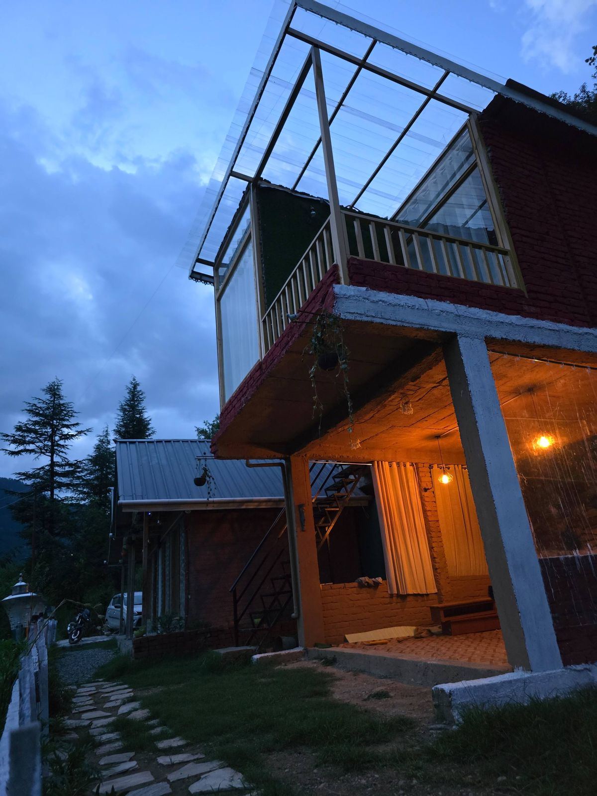 The Glass House among the hills in Chhet, near Jibhi